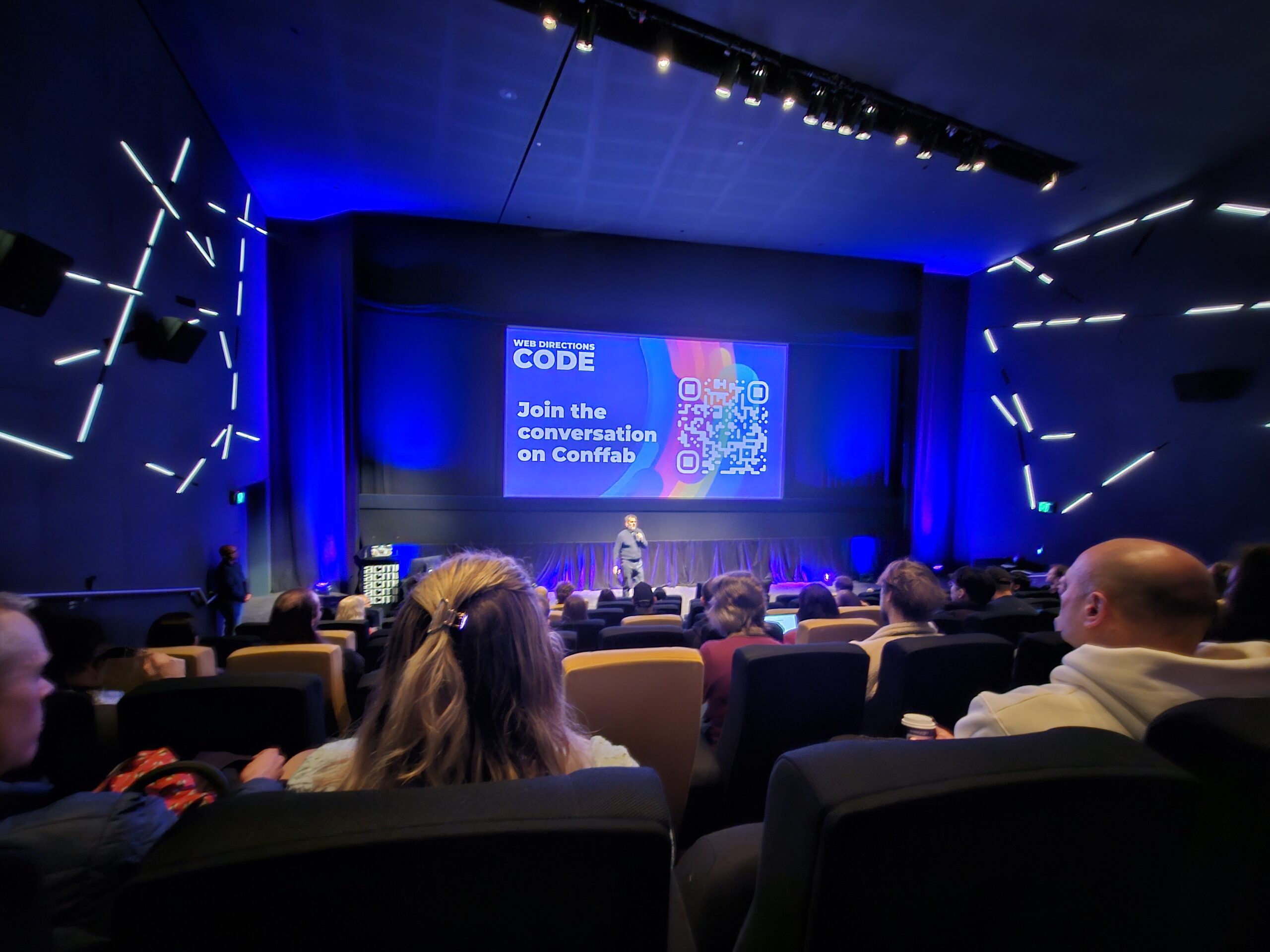 Image of theatre with Web Directions Conference speaker on stage.